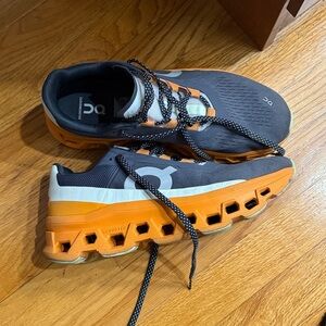 On Running Sneakers in Charcoal and Tangerine